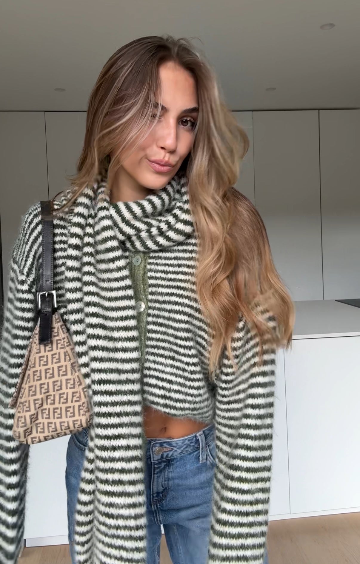 Soft striped cardigan in a muted color